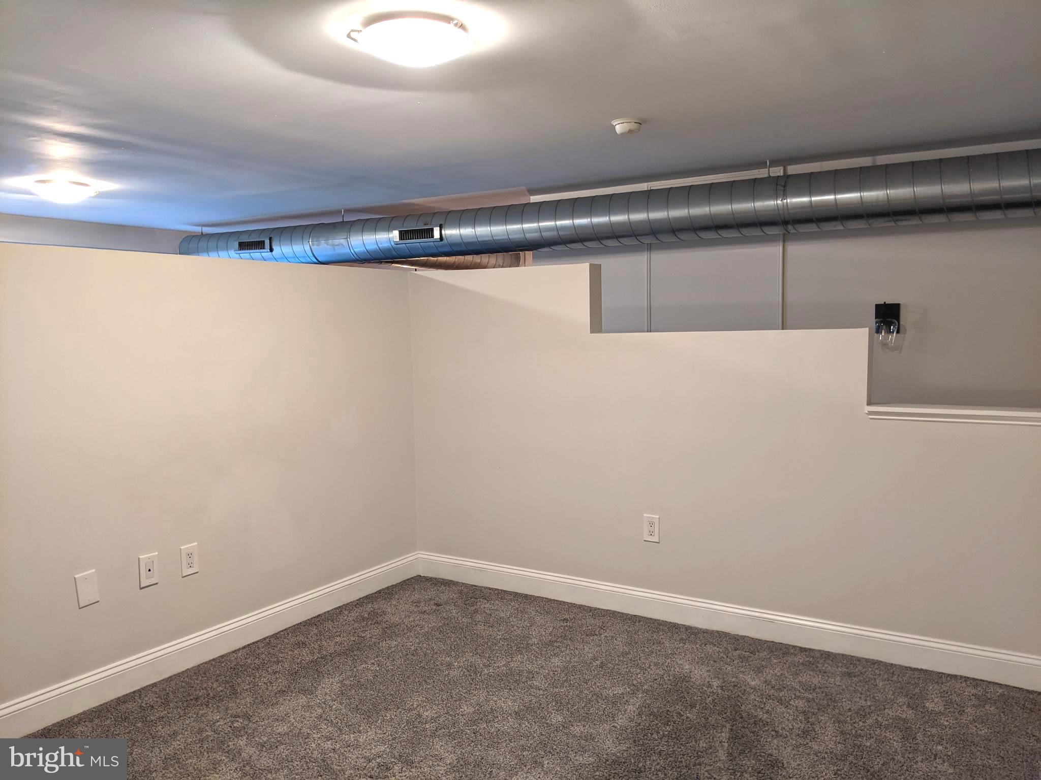 1100 South Broad Street, Unit 309B Philadelphia, PA 19146 - Photo 14 of 34 a view of a room with racks on the wall