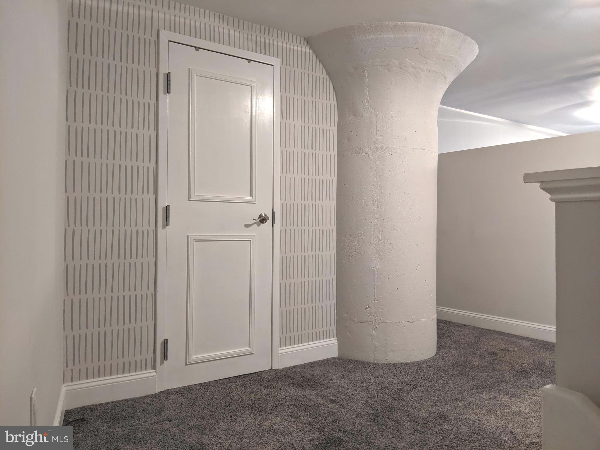 1100 South Broad Street, Unit 309B Philadelphia, PA 19146 - Photo 15 of 34 an empty room with windows