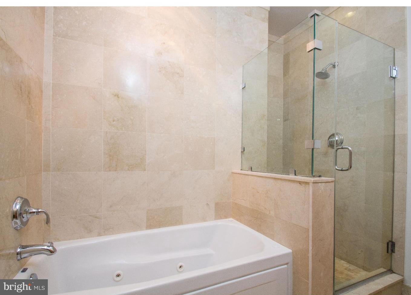 1100 South Broad Street, Unit 309B Philadelphia, PA 19146 - Photo 17 of 34 a bathroom with a bathtub