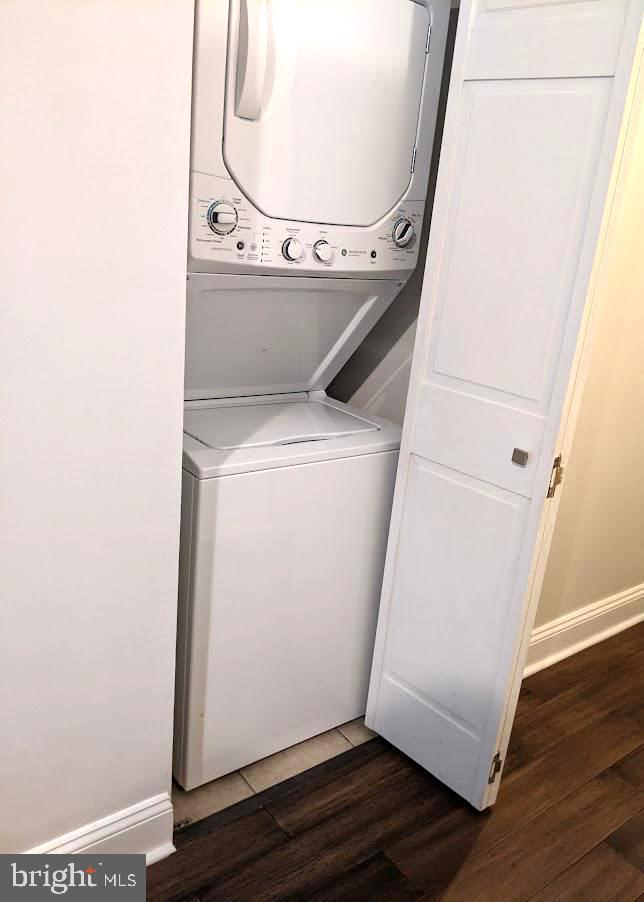 1100 South Broad Street, Unit 309B Philadelphia, PA 19146 - Photo 20 of 34 a view of washer and dryer with wooden floor