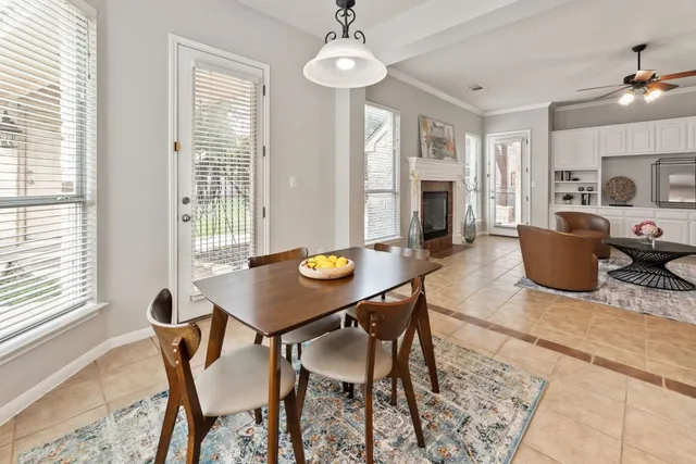 a view of a dining room with furniture and a window