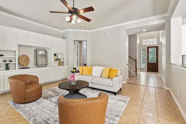 a living room with furniture and a rug