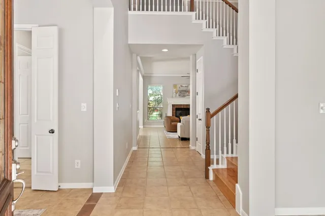 a view of a hallway with a livingroom and a hallway