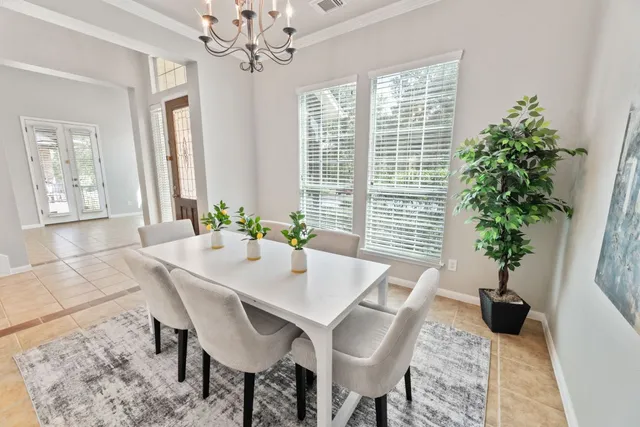 a view of a dining room with furniture and window