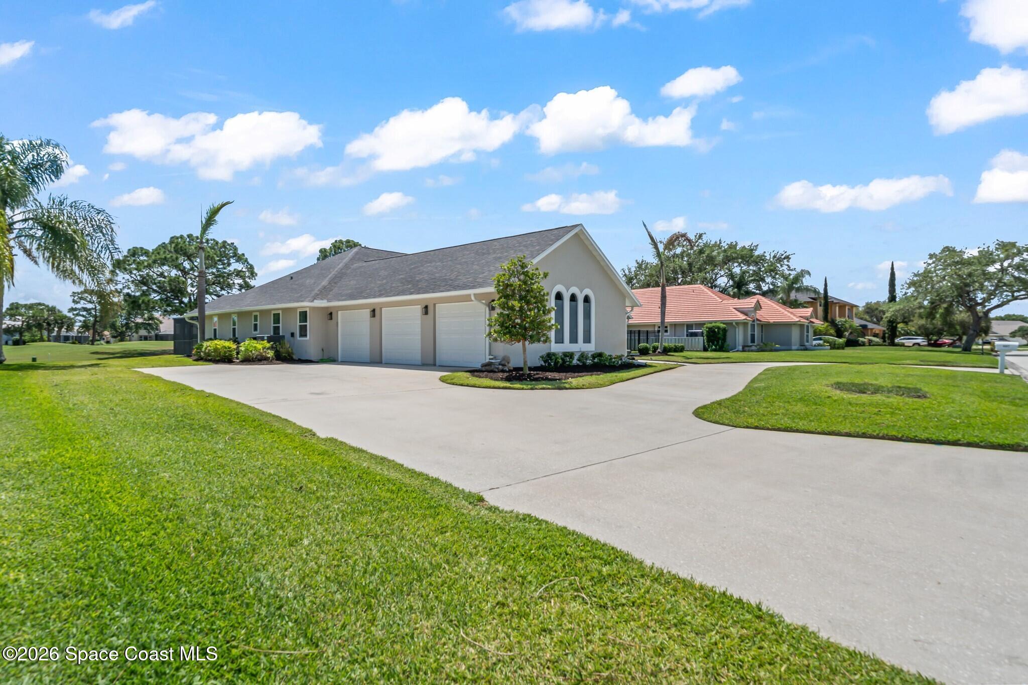 697 Spring Lake Drive Melbourne, FL 32940 - Photo 4 of 45 a view of yard in front of house with yard