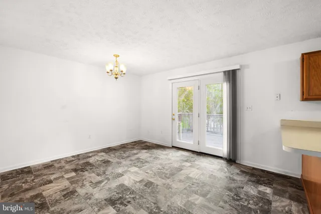 a view of empty room with front door