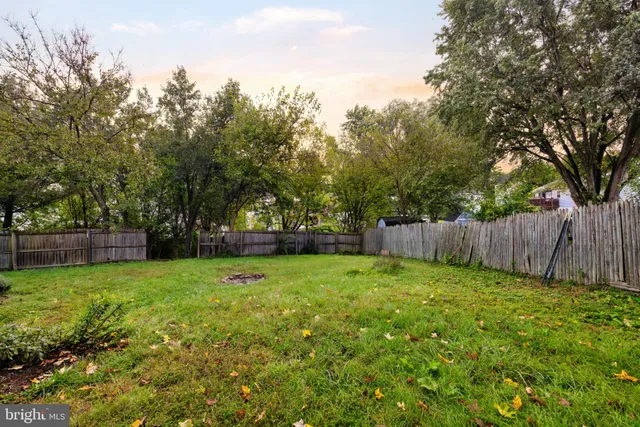 a house view with a sitting space and garden