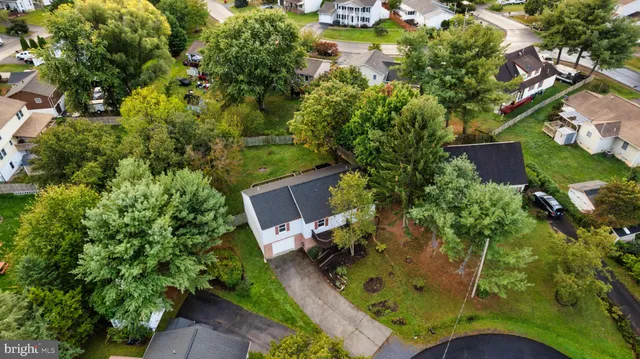 an aerial view of a house with yard swimming pool and outdoor seating