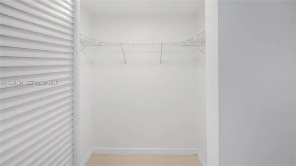 a view of bathroom with a washer and dryer