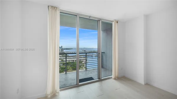 a view of an empty room and window