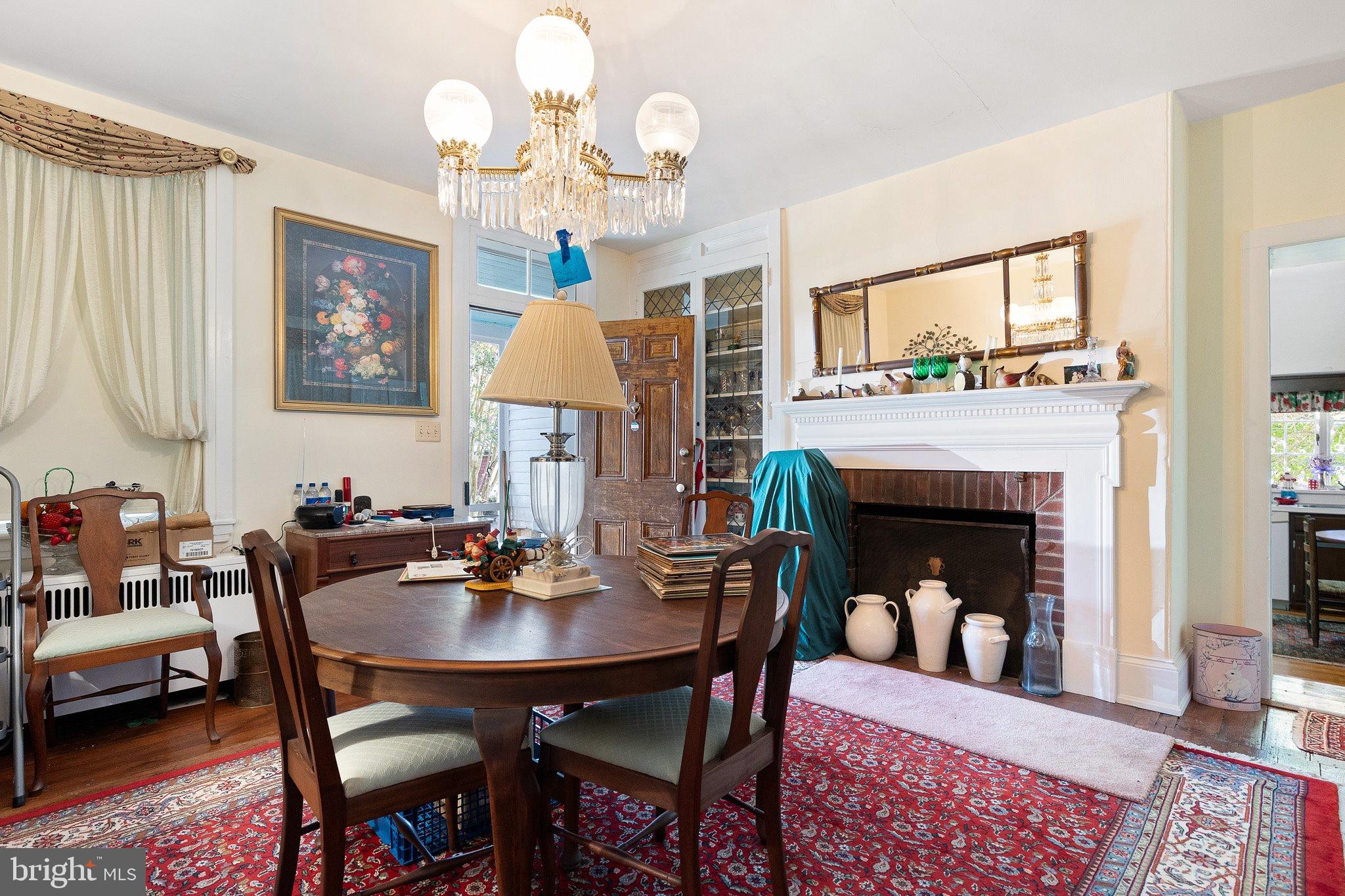 692 Bayview Road Middletown, DE 19709 - Photo 24 of 45 a view of a dining room with furniture and a fireplace