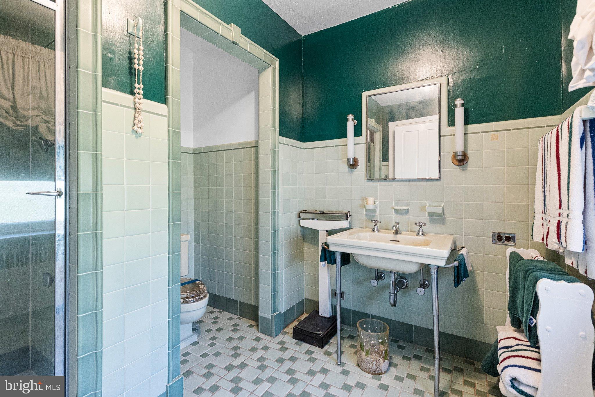 692 Bayview Road Middletown, DE 19709 - Photo 36 of 45 a bathroom with a sink a mirror and a shower