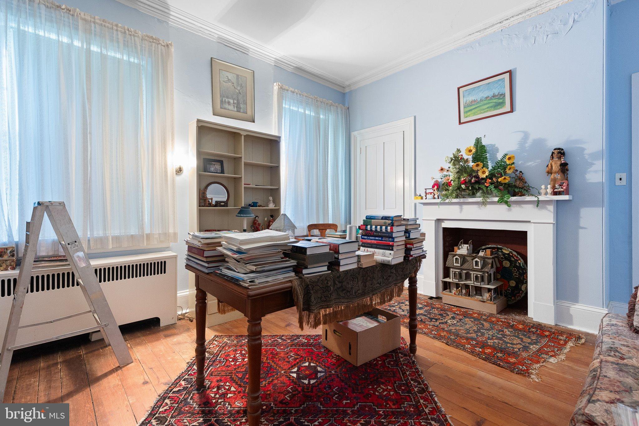 692 Bayview Road Middletown, DE 19709 - Photo 39 of 45 a living room with furniture a fireplace and a table