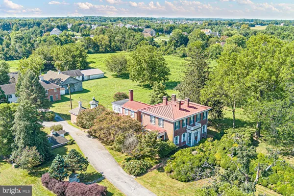 an aerial view of a house with a garden