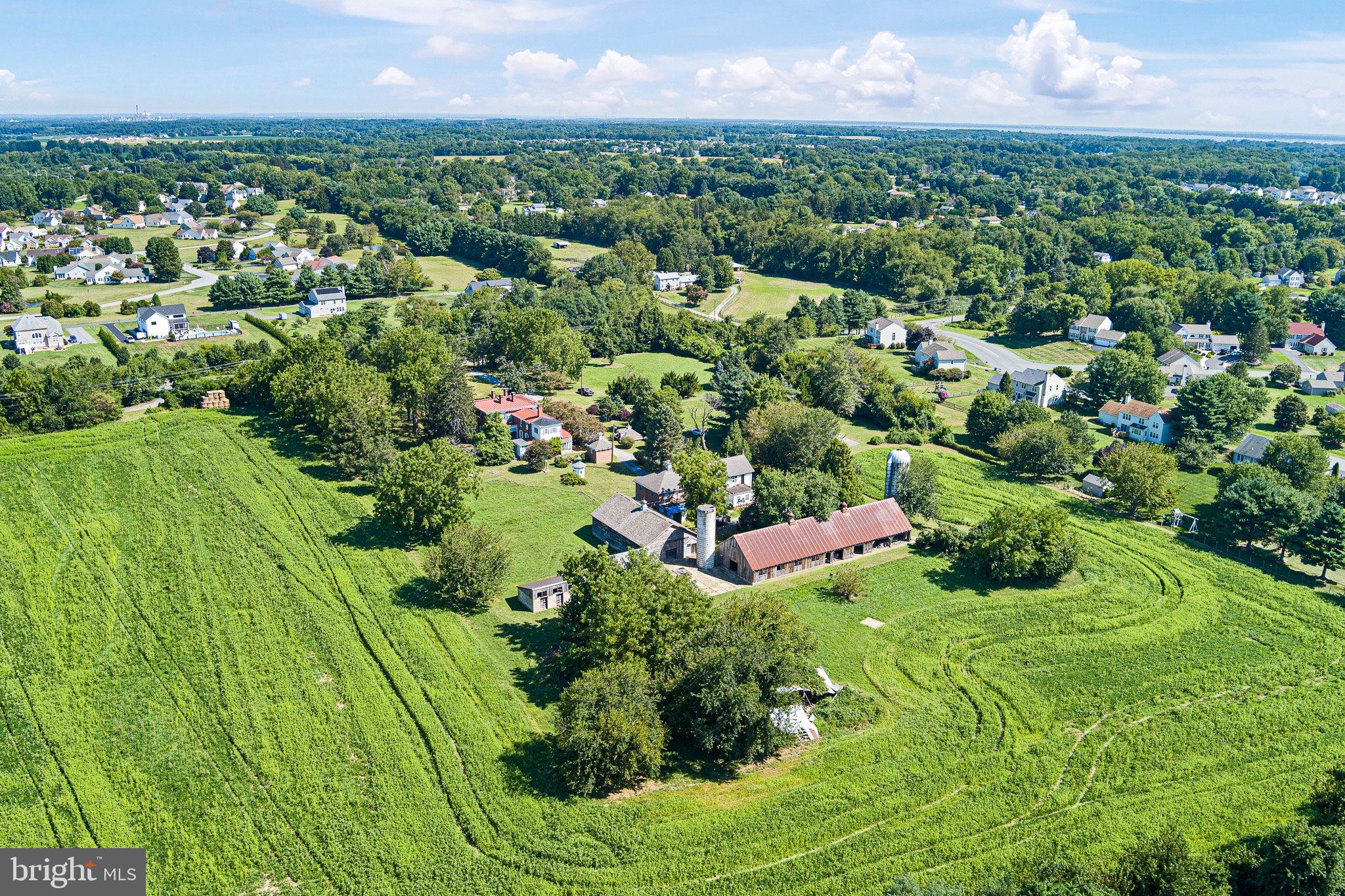 692 Bayview Road Middletown, DE 19709 - Photo 6 of 45 a view of a garden with a building in the background