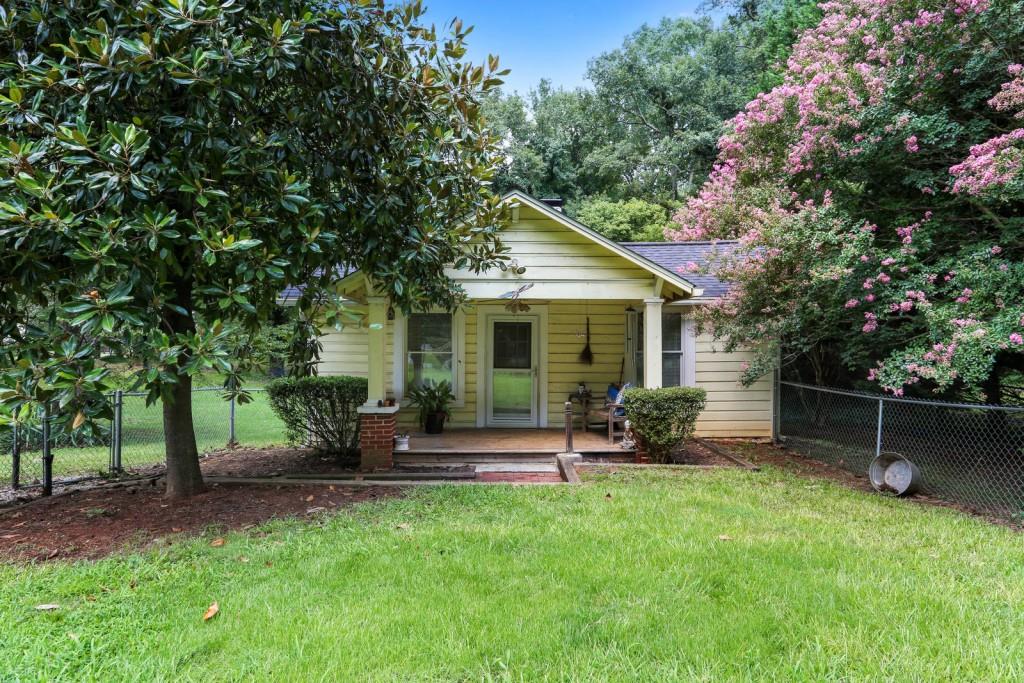 1000 Bates Road Austell, GA 30106 - Photo 1 of 1 a view of a house with backyard sitting area and garden