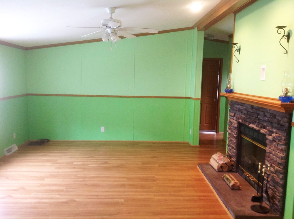 5 Medallion Road Holbrook, MA 02343 - Photo 4 of 10 a view of a room with a fireplace and a wooden floor