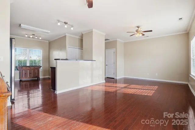 a view of livingroom with hardwood floor and a ceiling fan