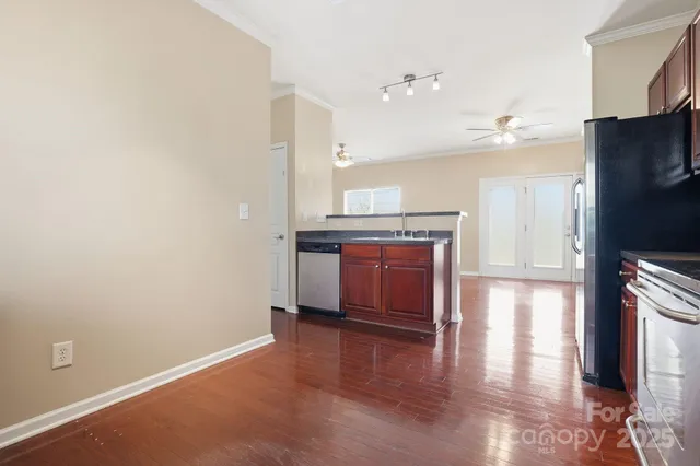 a room with a fireplace and wooden floor