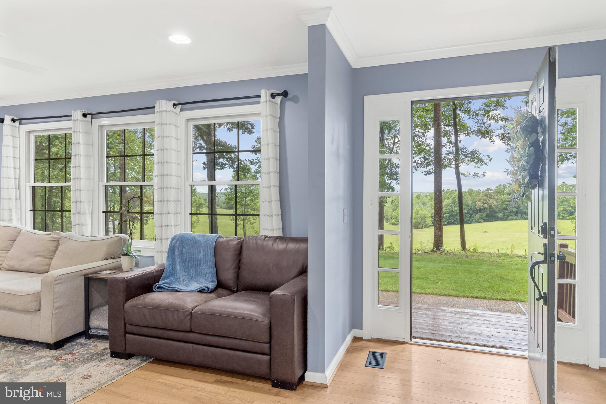 1425 Jacks Shop Road Rochelle, VA 22738 - Photo 11 of 56 a living room with furniture and a floor to ceiling window