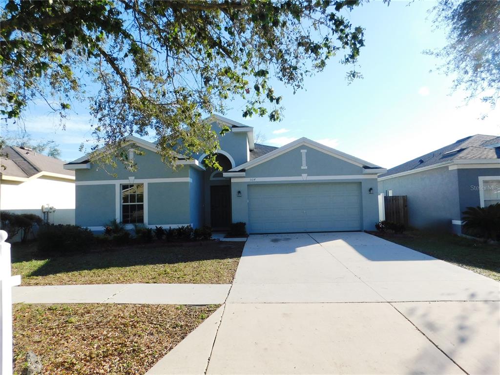 504 Magnolia Pointe Court Seffner, FL 33584 - Photo 1 of 1 a front view of a house with a yard and garage