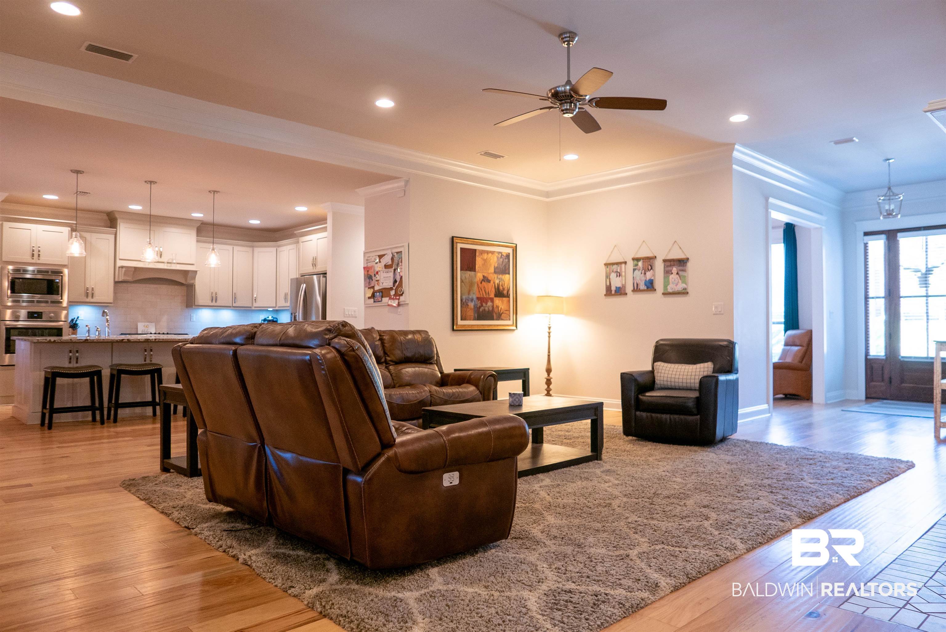 6684 Garrison Drive Daphne, AL 36527 - Photo 9 of 35 Living room with crown molding, light hardwood / wood-style flooring, and ceiling fan
