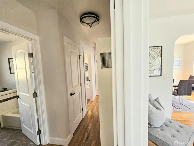 a view of a bathroom with a bathtub and a shower