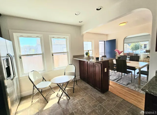 a view of a dining room with furniture window and outside view