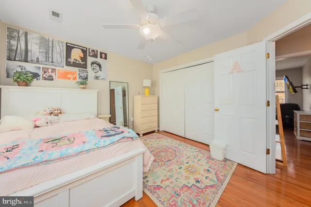 a bedroom with a bed and a book shelf