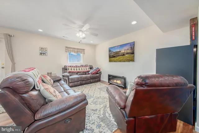 a living room with furniture and a chair