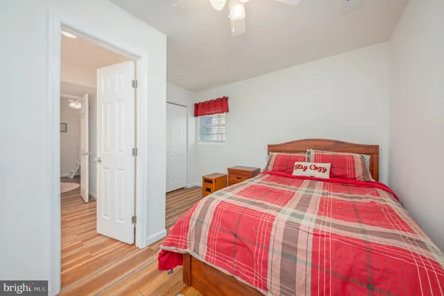 a bedroom with a bed and a closet