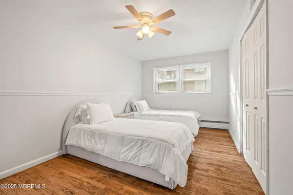 a bedroom with bed and a window