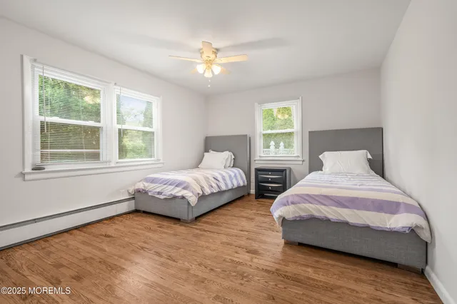a bedroom with bed and window