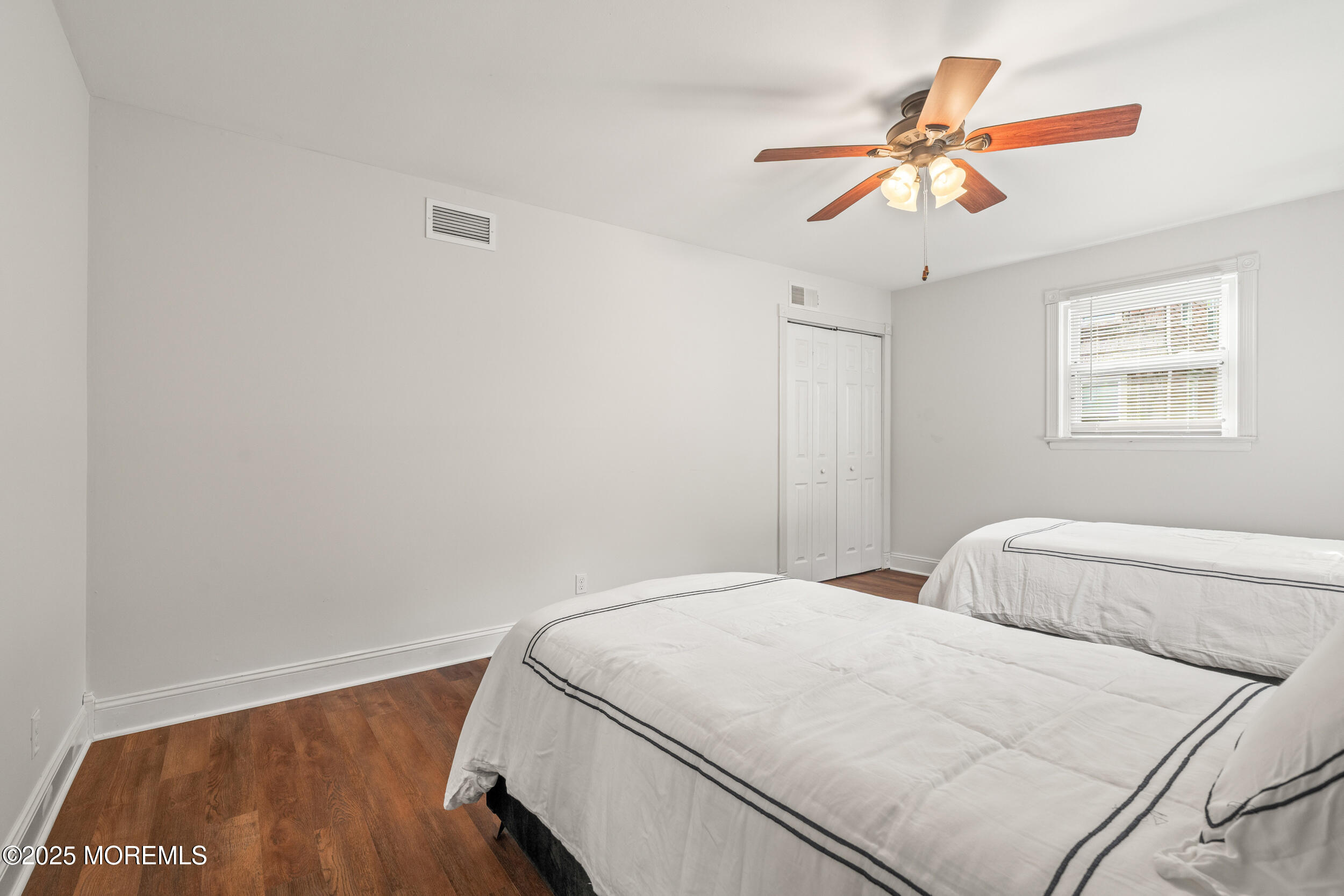 351 Hollywood Avenue Long Branch, NJ 07740 - Photo 21 of 34 a bedroom with a bed and a chandelier
