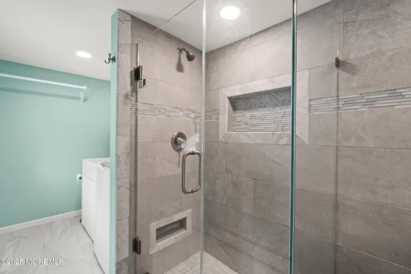 a bathroom with a shower and a shower