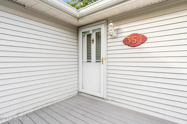 a view of a door and a window