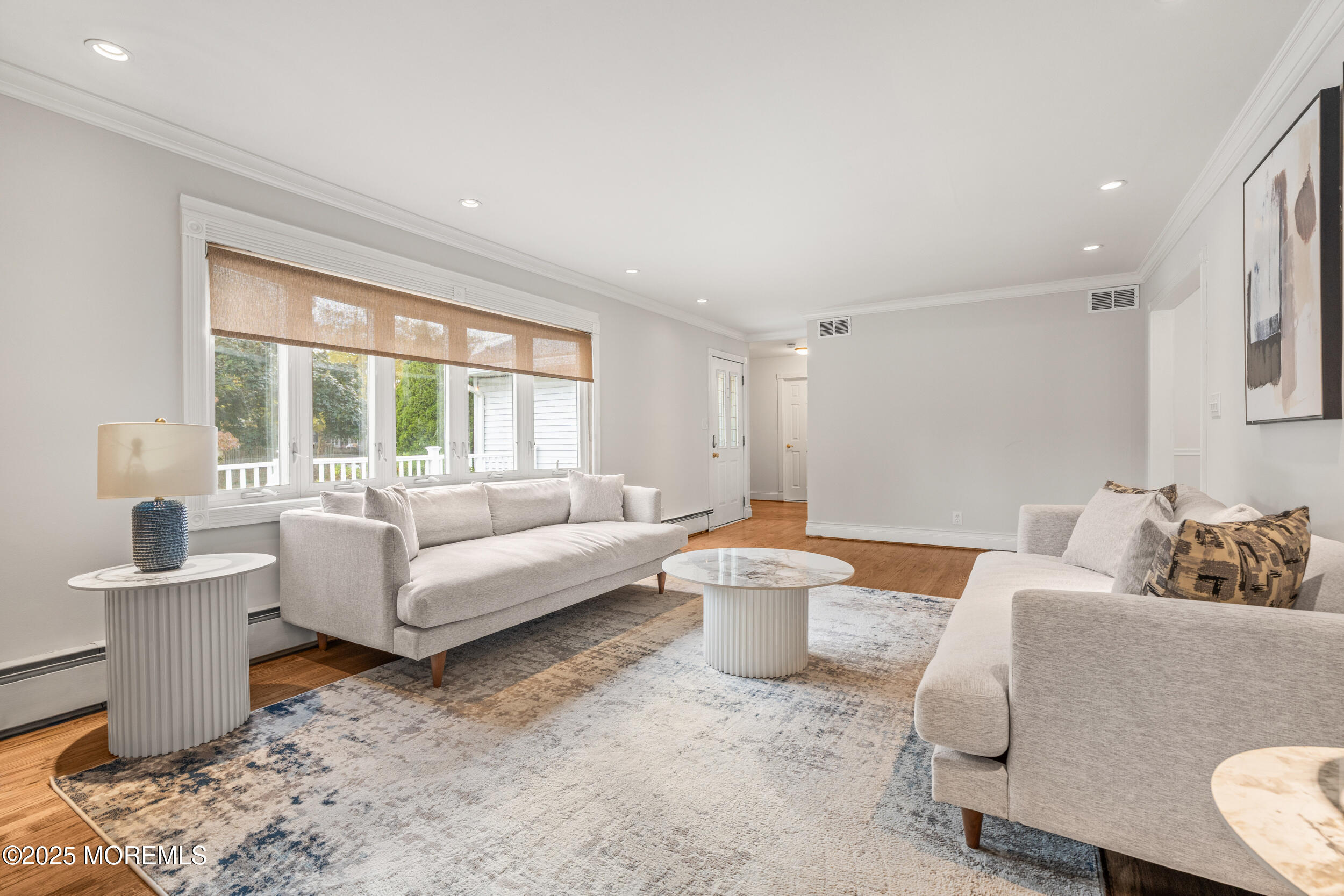 351 Hollywood Avenue Long Branch, NJ 07740 - Photo 4 of 34 a living room with furniture and a large window