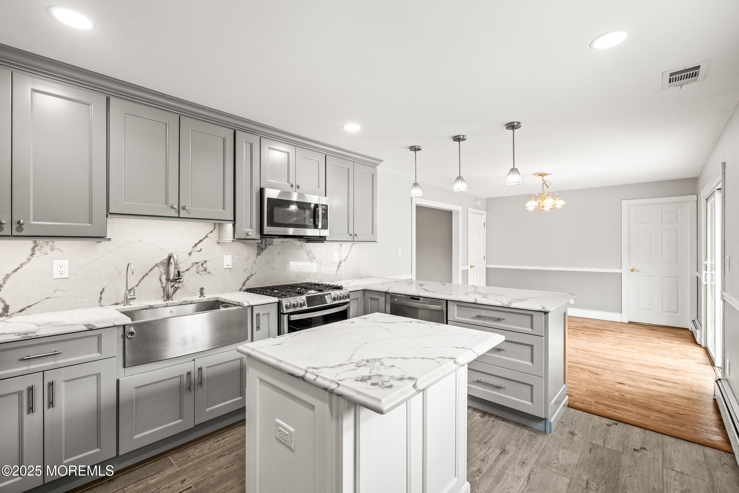 351 Hollywood Avenue Long Branch, NJ 07740 - Photo 9 of 34 a kitchen with stainless steel appliances granite countertop a sink stove and refrigerator