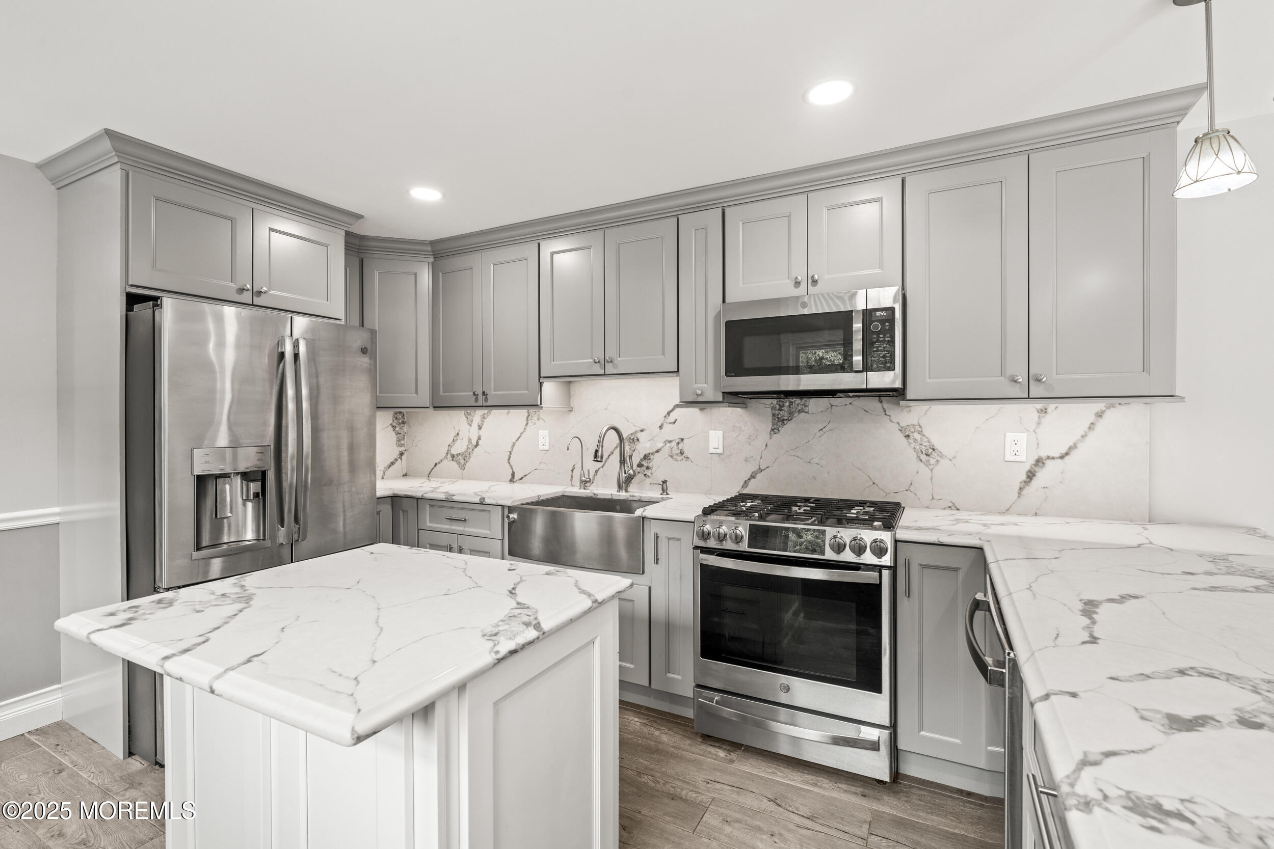 351 Hollywood Avenue Long Branch, NJ 07740 - Photo 10 of 34 a kitchen with a stove a refrigerator and a microwave
