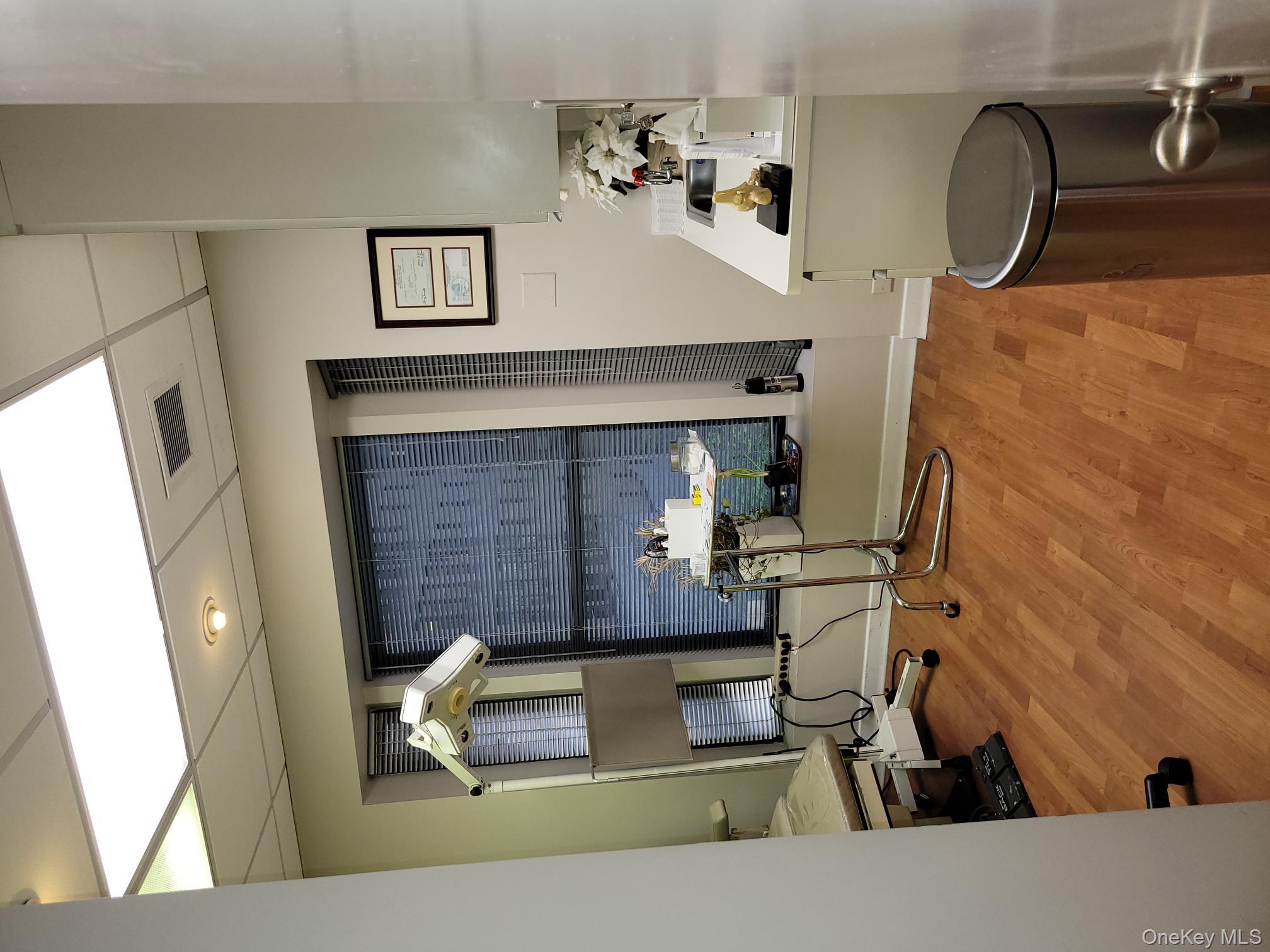 161 Madison Avenue, Unit 7SW Manhattan, NY 10016 - Photo 11 of 21 a room with gym equipment and view of living room