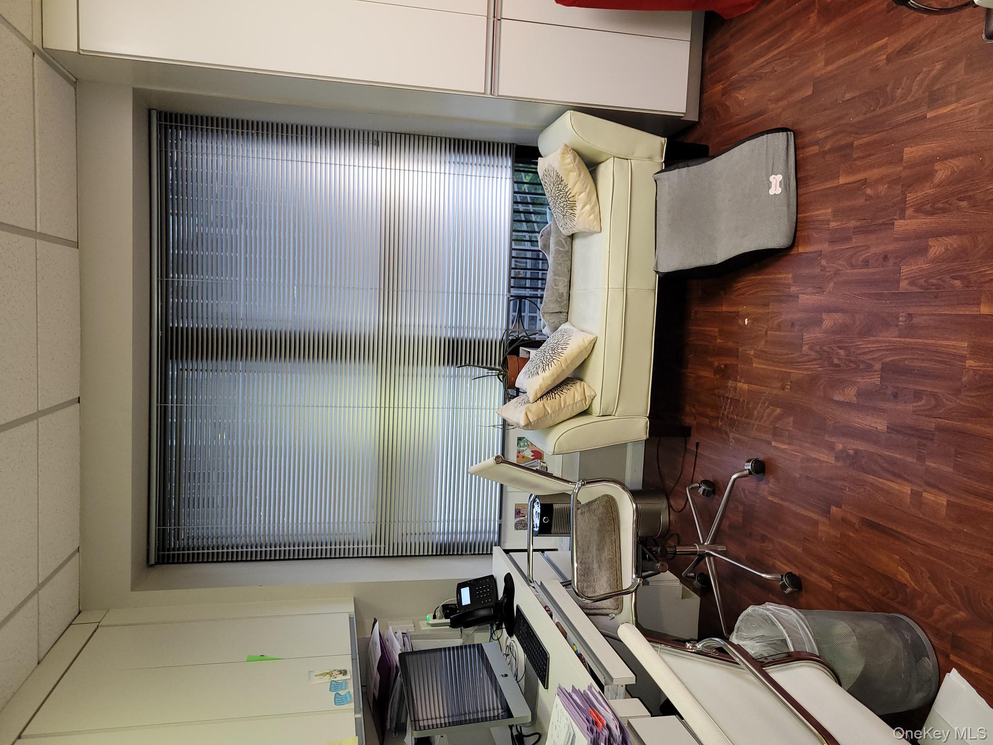 161 Madison Avenue, Unit 7SW Manhattan, NY 10016 - Photo 14 of 21 a view of a room with wooden floor and lounge chair