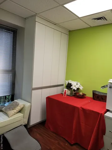 a living room with couches and painting on the wall