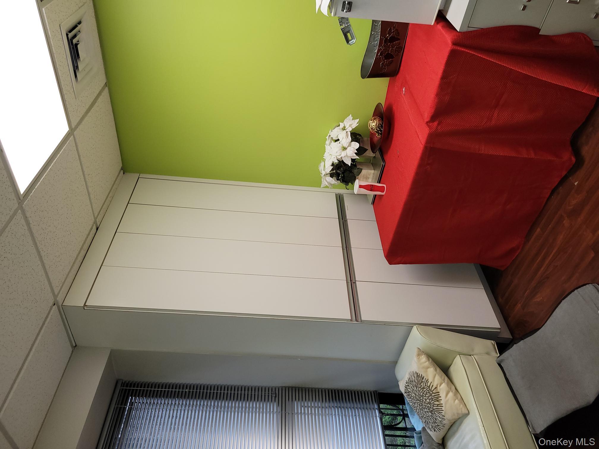 161 Madison Avenue, Unit 7SW Manhattan, NY 10016 - Photo 15 of 21 a bedroom with a bed and teddy bear on bed