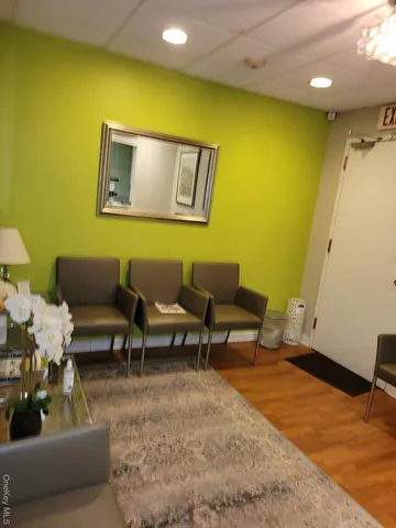 a room with gym equipment and a flat screen tv