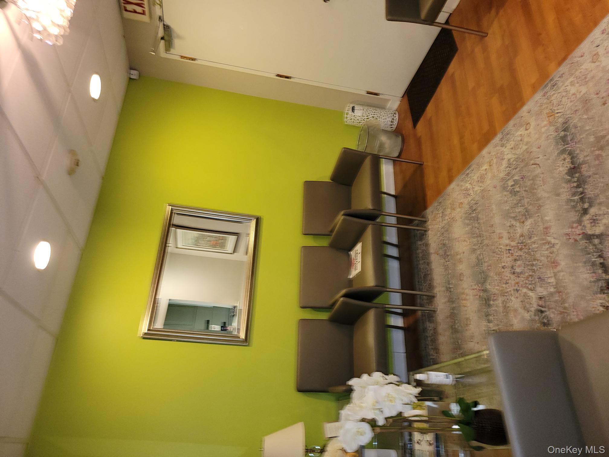 161 Madison Avenue, Unit 7SW Manhattan, NY 10016 - Photo 16 of 21 a living room with couches and painting on the wall