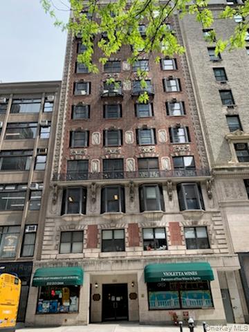 161 Madison Avenue, Unit 7SW Manhattan, NY 10016 - Photo 2 of 21 a front view of a building with a garden