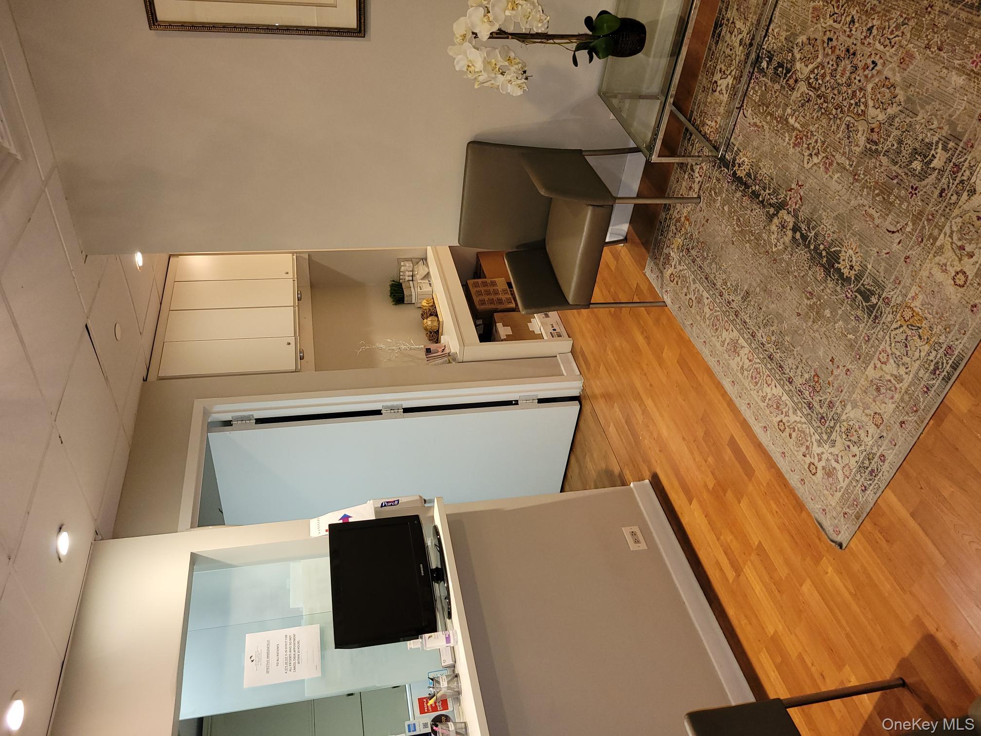 161 Madison Avenue, Unit 7SW Manhattan, NY 10016 - Photo 6 of 21 a living room with furniture and a flat screen tv