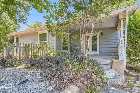 front view of a house with a garden