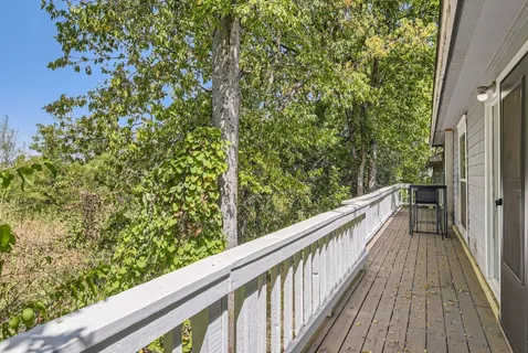 a view of balcony and yard