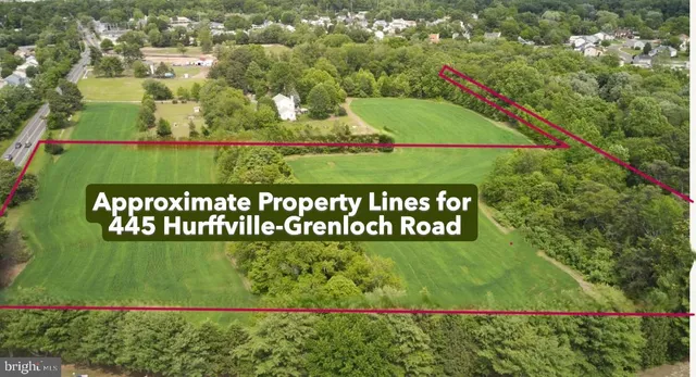 a picture of a room with a white wall and a painting on the wall